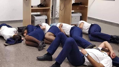 Six Ryanair crew have lost their jobs after staging a photo sleeping on an airport floor