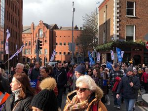 Thousands of people march through Dublin in support of striking nurses and midwives
