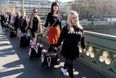 Women march with suitcases to protest against Northern Ireland’s abortion laws