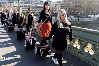 Women march with suitcases to protest against Northern Ireland’s abortion laws