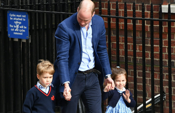 This side by side photo shows how alike Princess Charlotte and Prince William are