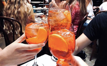 An Aperol Spritz pool party featuring an orange waterfall is happening this summer