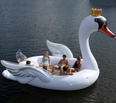 You can now get a giant glitter swan pool float that comfortably fits six people