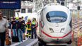 Boy, 8, dies after he and his mother are deliberately pushed onto train tracks in Germany