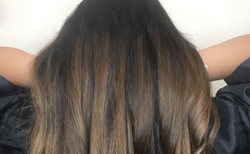 The Gold Obsidian trend is the perfect subtle update for your dark hair this summer