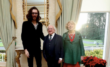Hozier switches on Christmas lights with Michael D, is very tall while doing so