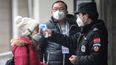 Ten Chinese cities locked down and Beijing celebrations scrapped as Wuhan virus death toll rises