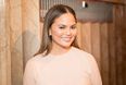 Chrissy Teigen mourns dog Pippa who “died in my arms”