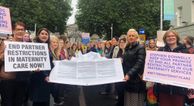 Hundreds gather outside Dáil Éireann to call for an end to maternity restrictions