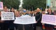 Hundreds gather outside Dáil Éireann to call for an end to maternity restrictions
