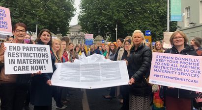 Hundreds gather outside Dáil Éireann to call for an end to maternity restrictions