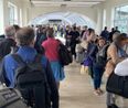 Airport passengers left furious as queues stretch all the way to car park