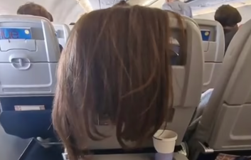 Woman left stunned after plane passenger drapes hair over back of her seat