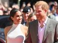 Prince Harry and Meghan look happier than ever in rare public appearance