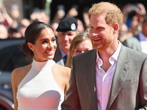 Prince Harry and Meghan look happier than ever in rare public appearance