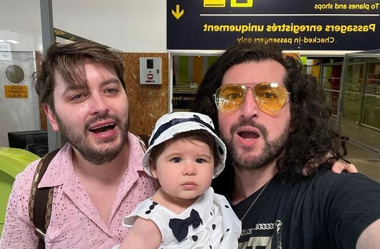 Brian Dowling with husband, Arthur, and baby Blake