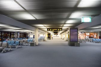 Woman loses leg after getting caught in moving walkway at airport