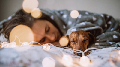 Science says people who let their dogs sleep in their bed are happier