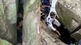 Woman trapped upside down between boulders for seven hours after trying to retrieve phone