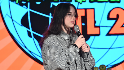 Billie Eilish hit in the face by object during performance